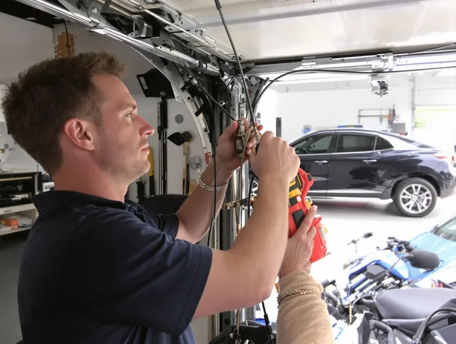 Anaheim Garage Door Repair safety certified technician performing cable replacement in Anaheim